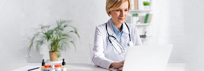 Chiropractic Danville VA Doctor On Computer